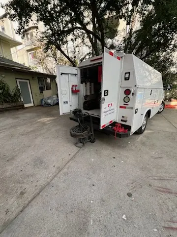 Magnet Plumbing service vehicle on-site for Grease Trap Cleaning in Holiday Estates